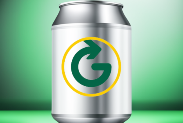 An aluminium can on a green background, with a greyhound circular logo
