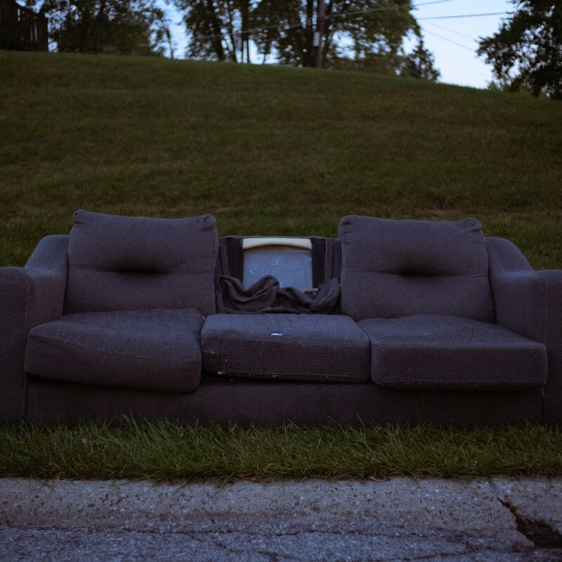 Bulky Waste - sofa being disposed of at the side of the road