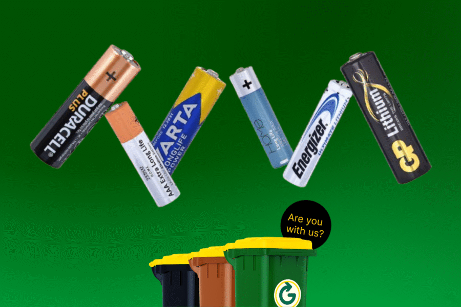 Green Background with bins and 6 batteries for a blog around - Can I Put Batteries in My Recycle Bin?